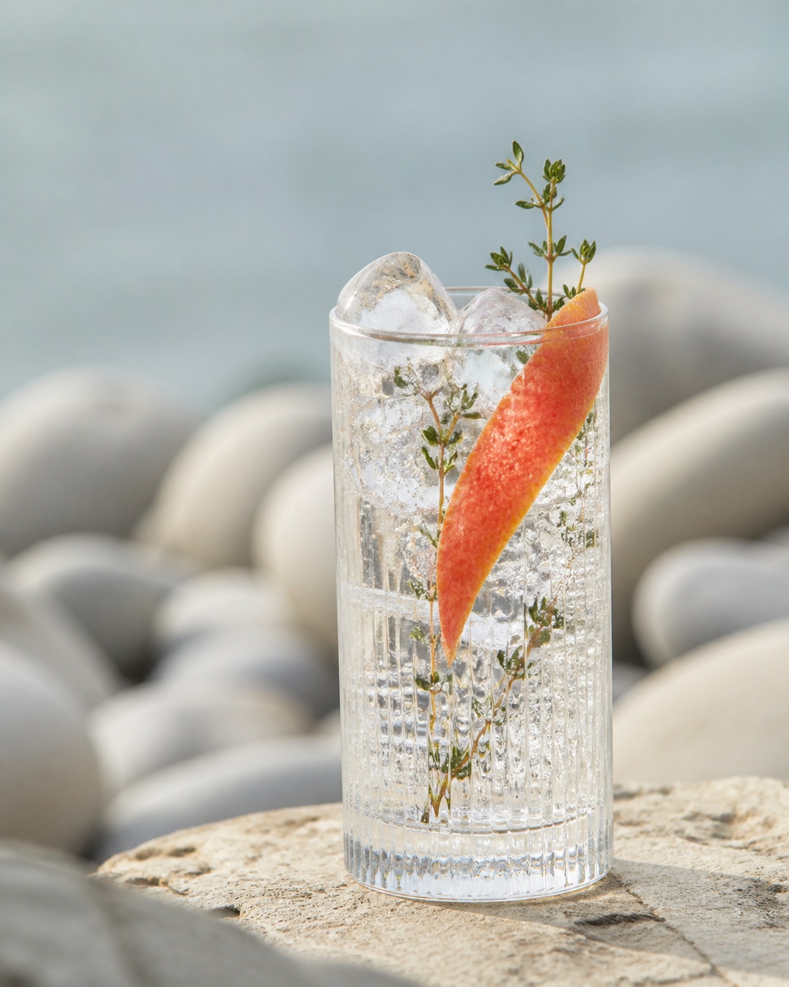 Nordlys Premium Distilled Gin served with Fever-Tree Indian Tonic Water, garnished with grapefruit peel and rosemary tip